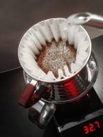 Filter coffee being made and weighed.