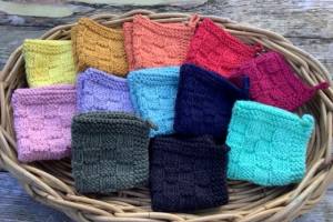 Photo of 12 different coloured flannels.