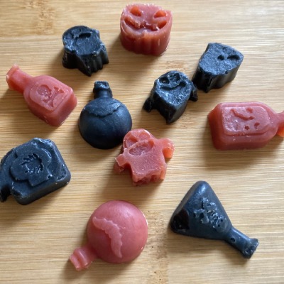 Photo of red and black little soaps. Potion bottles, ghosts, pumpkin.
